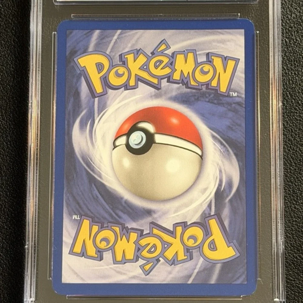 Pokemon Dark Machamp Non-Holo 1st Ed. 27/82 CGC 8.5 TCG Team Rocket 2000 WotC